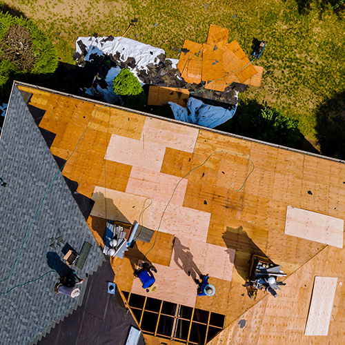 Roof replacement Oklahoma City top-down view of roof under construction
